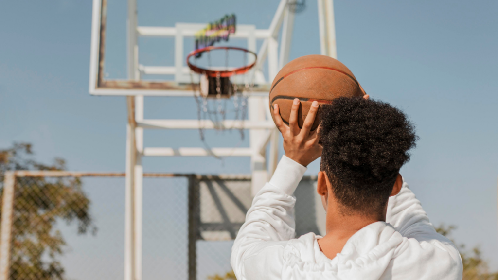 A man is about to shoot a basketball.